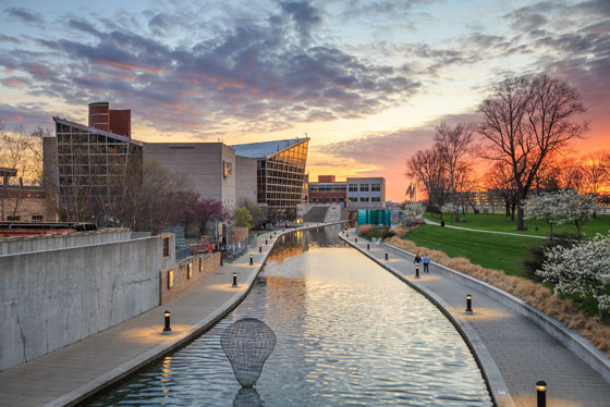Indiana State Museum at sunset by the canal path.
